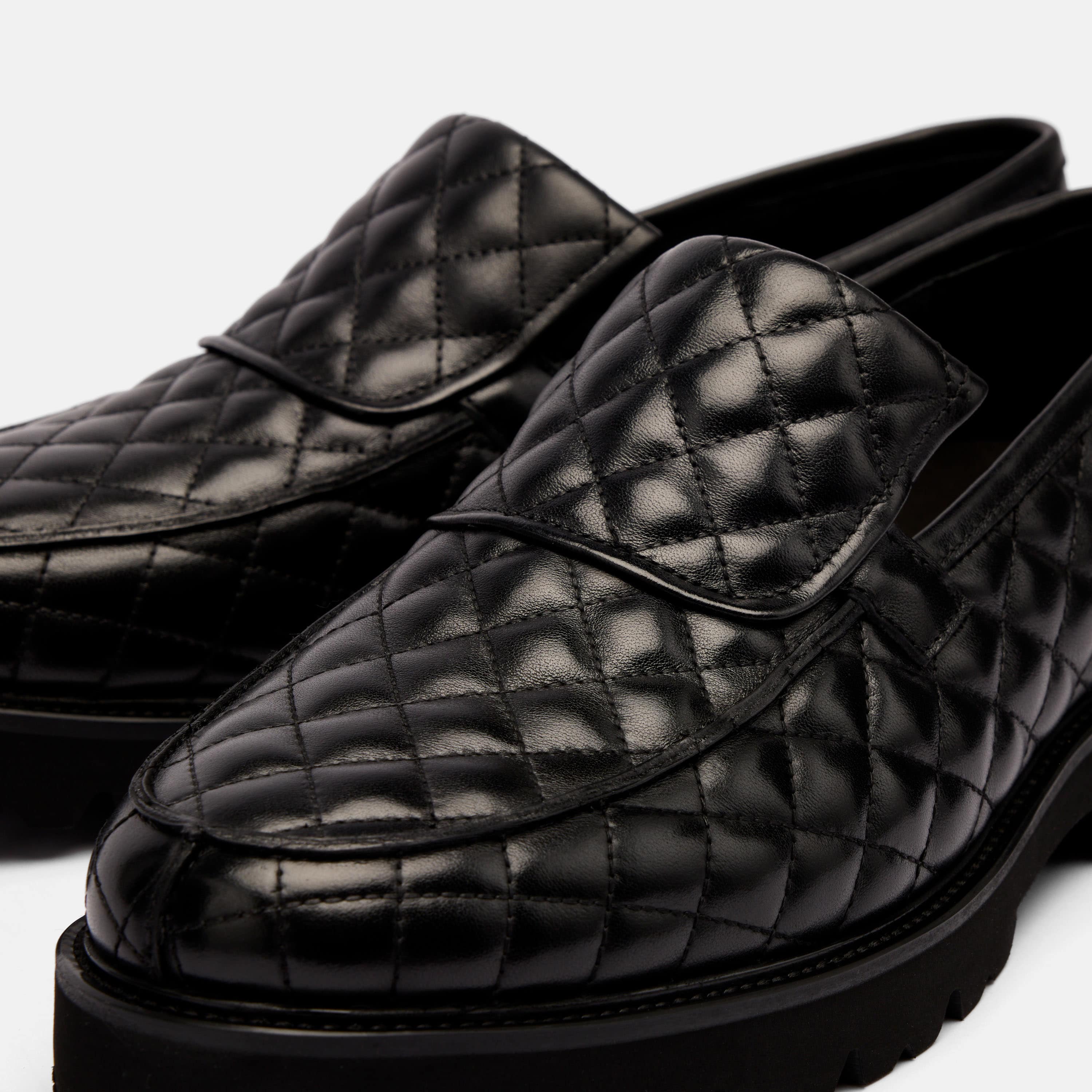 The Pitch Black Quilted Leather Lug Penny Loafers