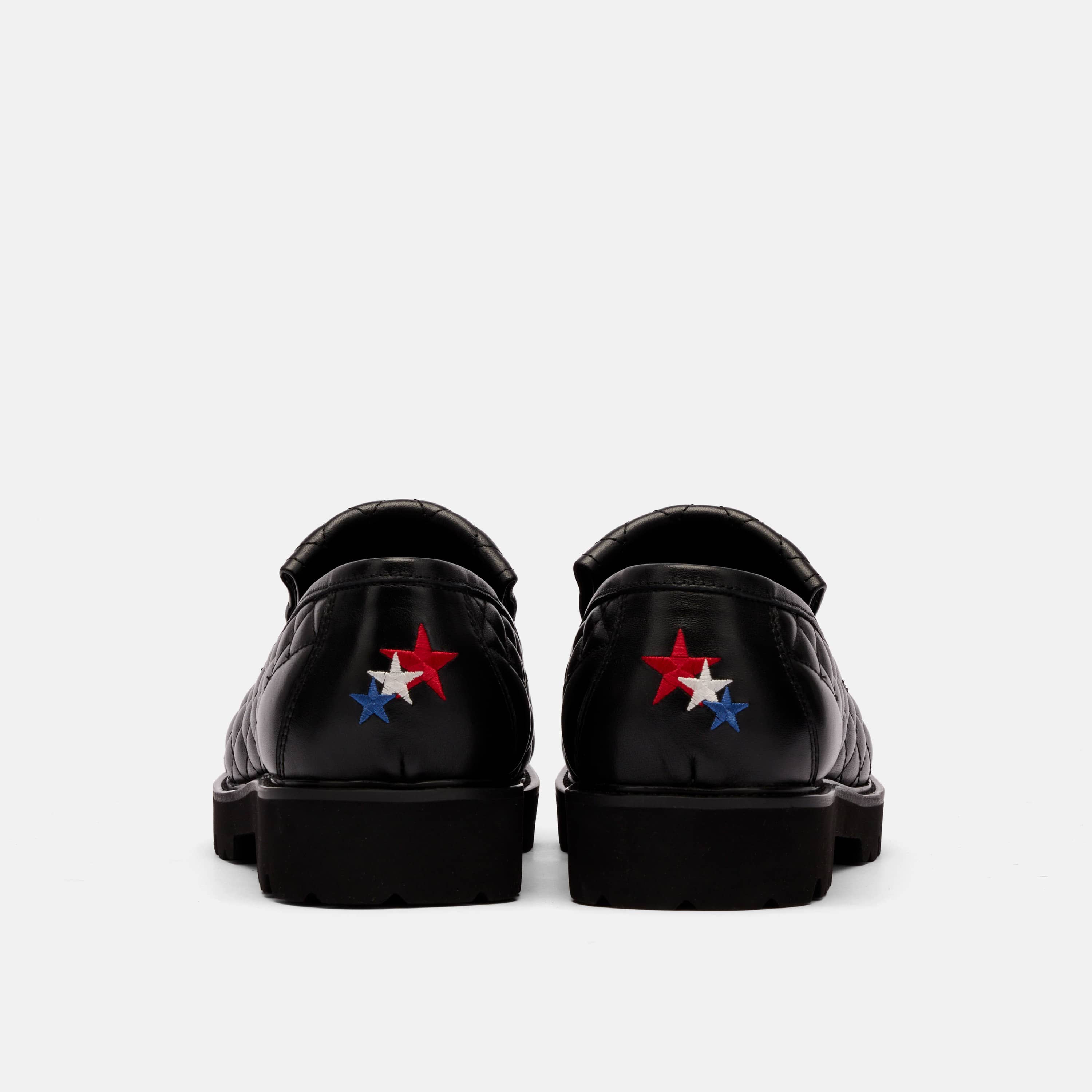 The Pitch Black Quilted Leather Lug Penny Loafers