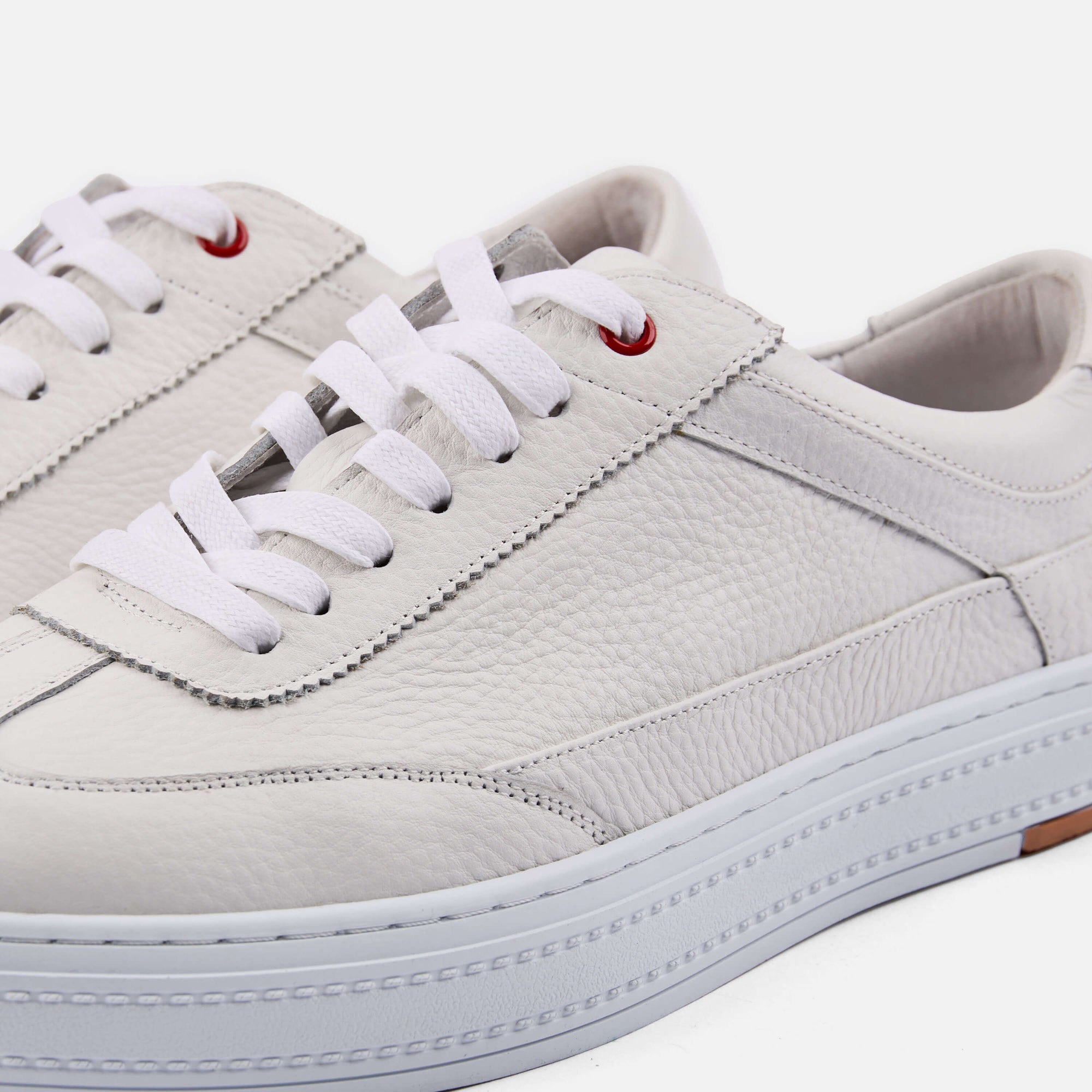Captain White Pebble Leather Sneakers
